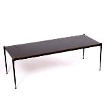 A retro vintage coffee table, the ebonised top on black metal supports with slender tapering legs,