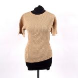 An Issey Miyake short sleeved champagne pleated top,