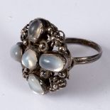 Style of George Jensen, a silver and moonstone ring, set with five cabochon stones,