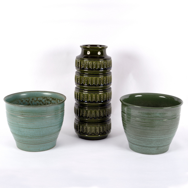 A 1970s German cylindrical vase, olive green glaze, 41cm high and two green ceramic planters,
