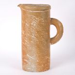 Kerstin Hornlund (born 1940), a tall stoneware jug of flattened ovoid form, oatmeal textured glaze,