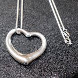 Elsa Peretti for Tiffany, a silver open heart pendant on Brazilian link chain,