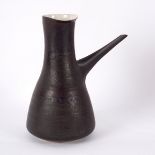 Lucie Rie (1902-1995), a coffee pot, with manganese glaze and cream interior, elongated handle,