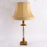 A glass and brass table lamp, fitted for electricity,