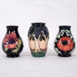 Moorcroft Pottery, three vases: Cluny, 10.5cm high, Anemone, 9.75cm high, Poppy, 9.