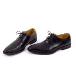 Junya Watanabe for Comme des Garcons, a pair of black leather lace-up shoes, size M,