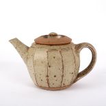 Richard Batterham (born 1936), a small cut sided stoneware teapot, ash glaze with iron speckle,