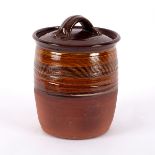 Ray Finch (1914-2012), an earthenware lidded pot, with ridged caramel glaze to upper part,