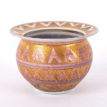 Mary Rich (born 1940), a porcelain bowl with flared rim decorated gold geometric patterns on pink,