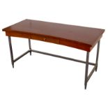 An Art Deco style desk, veneered in burr walnut, the curved front fitted a small central drawer,