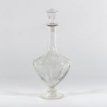 Style of James Powell & Sons, a clear glass decanter with dimpled sides,