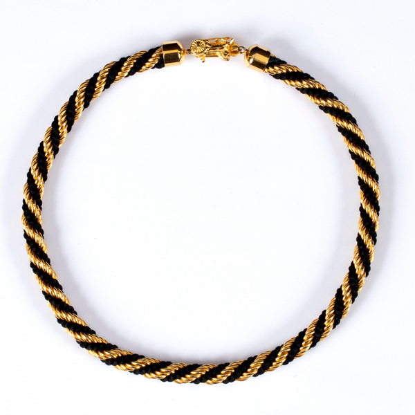 Celine, a black and gold twisted rope style necklace, the clasp stamped,