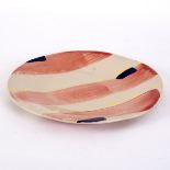 Sandy Brown (born 1946), a painted pottery charger, geometric designs in salmon,