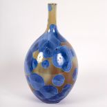 Simon Rich (born 1949), a crystalline glazed stoneware bottle vase, cobalt blue and ochre,