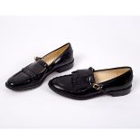 Robert Clergerie, a pair of black leather slip on shoes,