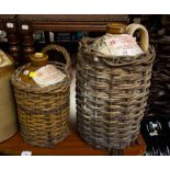 2 STONEWARE WHISKEY JARS IN BASKETS - JOHN EGAN + SONS WITH ORIGINAL LABELS