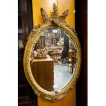 ANTIQUE ORNATE GILT OVAL MIRROR