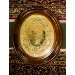 ANTIQUE EMBROIDERY IN OVAL MAHOGANY FRAME