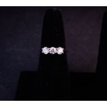 3 STONE DIAMOND RING. TOTAL DIAMOND .