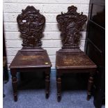 PAIR OF CARVED OAK HALL CHAIRS