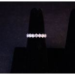 7 STONE DIAMOND RING. TOTAL DIAMOND .