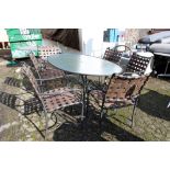 Brown Jordan out door chipped glass oval dining table en suite with (6) woven armchairs
