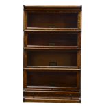 An Arts and Crafts Globe Wernicke stackable quartersawn oak barrister bookcase