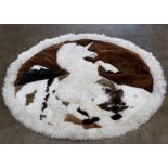Round sheepskin carpet depicting a prancing unicorn