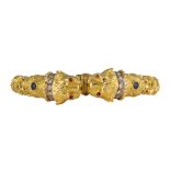 Diamond, ruby, sapphire, 18k yellow gold lion head bracelet