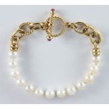 Cultured pearl, ruby, 14k yellow gold bracelet