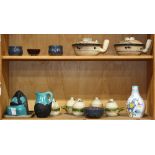 Two shelves of pottery