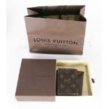 A Louis Vuitton wallet with original bag and box