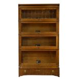 An Arts and Crafts quartersawn oak stackable barrister bookcase