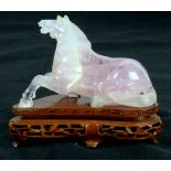 Small Chinese rose quartz carved horse on stand