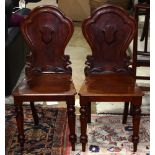 Pair of English mahogany hall chairs
