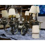 Contemporary Louis XV style white metal ten light chandelier