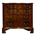 A George III style serpentine chest of drawers