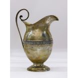 A Continental silver gilt creamer waisted with a chased antheniom leaf band 9toz