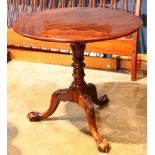 A Chippendale style solid mahogany tripod tea table