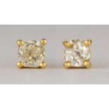 Pair of diamond, 14k yellow gold earrings