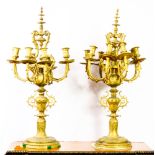 A pair of continental gilt bronze candelabra executed in the Renaissance taste