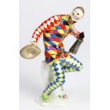 A finely enameled Meissen porcelain Harlequin after a model by J.J. Kandler