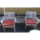Pair of Kingsley Bate Chippendale style outdoor teak arm chairs