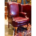 Chippendale style red leather wing back chair