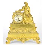 A Napoleon III gilt bronze figural mantel clock