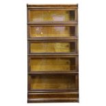 An Arts and Crafts style oak barrister bookcase