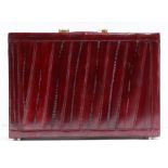 Vintage red eel leather briefcase, the brass hardware marked "presto"