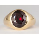 Garnet, 18K yellow gold ring Featuring (1) oval-cut garnet, weighing approximately 5.75 cts., set in