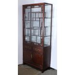 A Chinese-style wood displaycabinet, a glass displaying shelf on the top, together with two