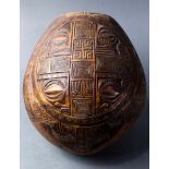 A Marquesas Islands elaborately carved bowl, 20th Century, with a crack to the bowl, 11"h;